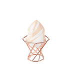 DEAR DAHLIA Marble Multi Blender resting in a rose-gold octagonal stand beside DEAR DAHLIA makeup products.