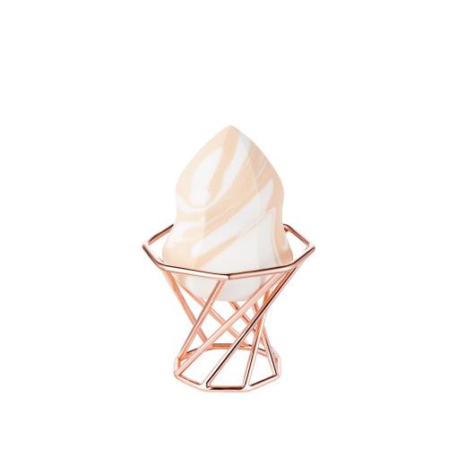 DEAR DAHLIA Marble Multi Blender resting in a rose-gold octagonal stand beside DEAR DAHLIA makeup products.