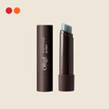 OBgE Mood Change Lip Balm in its dark brown tube with the balm exposed