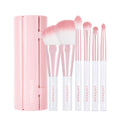 CORINGCO Pink Roll Brush Set 6P with six pink makeup brushes in a roll-up case