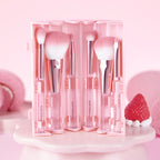 CORINGCO Pink Roll Brush Set 6P with six pink makeup brushes in a roll-up case