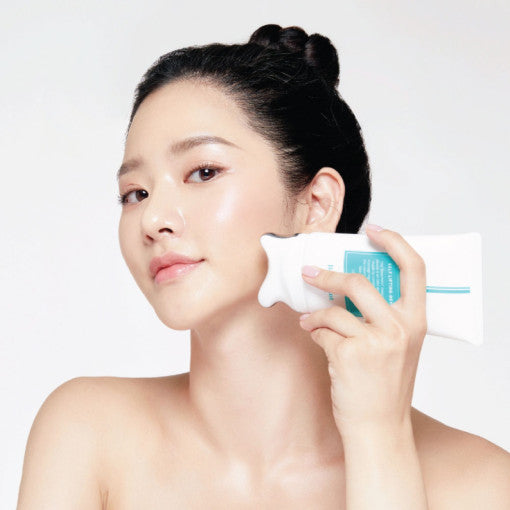 BeaumAnt Face & Body Liner Gua Sha Massage Cream 120ml used with its integrated gua sha applicator on the face