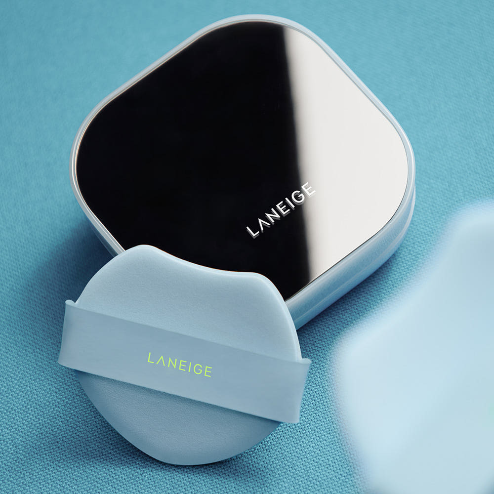 LANEIGE Neo Cushion Mewy cushion compact held beside a model's face