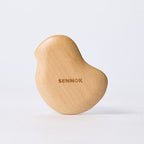 SENNOK Bbiyaki Guasha, a compact chick-shaped beech wood massage tool