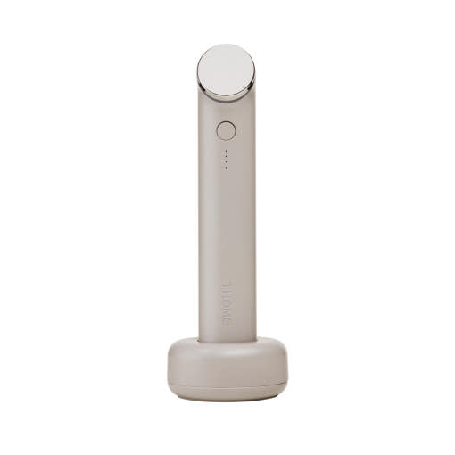 THOME The Glow Signature dual-frequency ultrasound facial beauty device on its charging stand